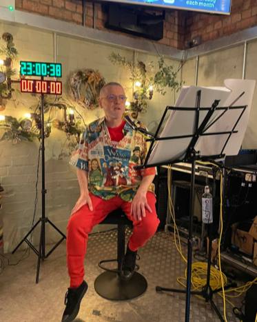 Dave Purchase from Gloucester set a new Guinness World Record by completing the longest Christmas song marathon, singing 684 festive songs over 42 hours with support from local choirs and fans.