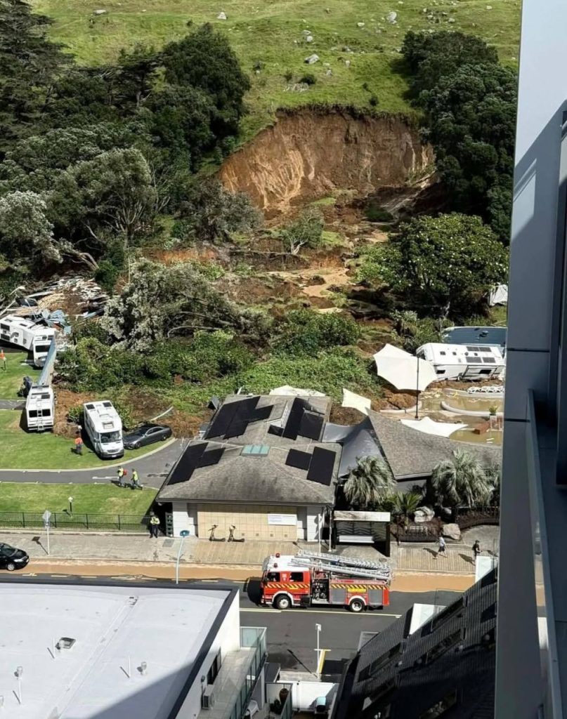 Landslides hit New Zealand campground and a nearby house after severe weather, leaving two people confirmed dead and others missing, authorities said.